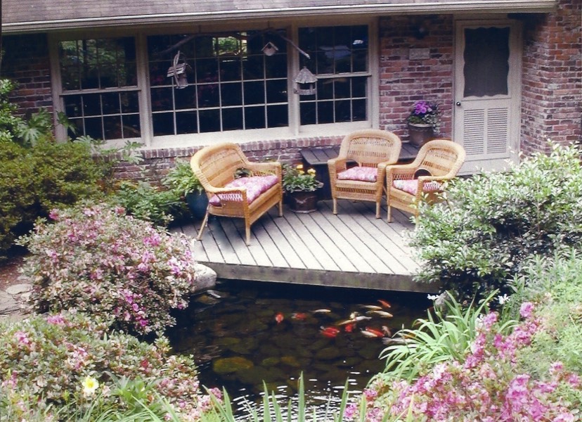 Deck at front door overlooks pond